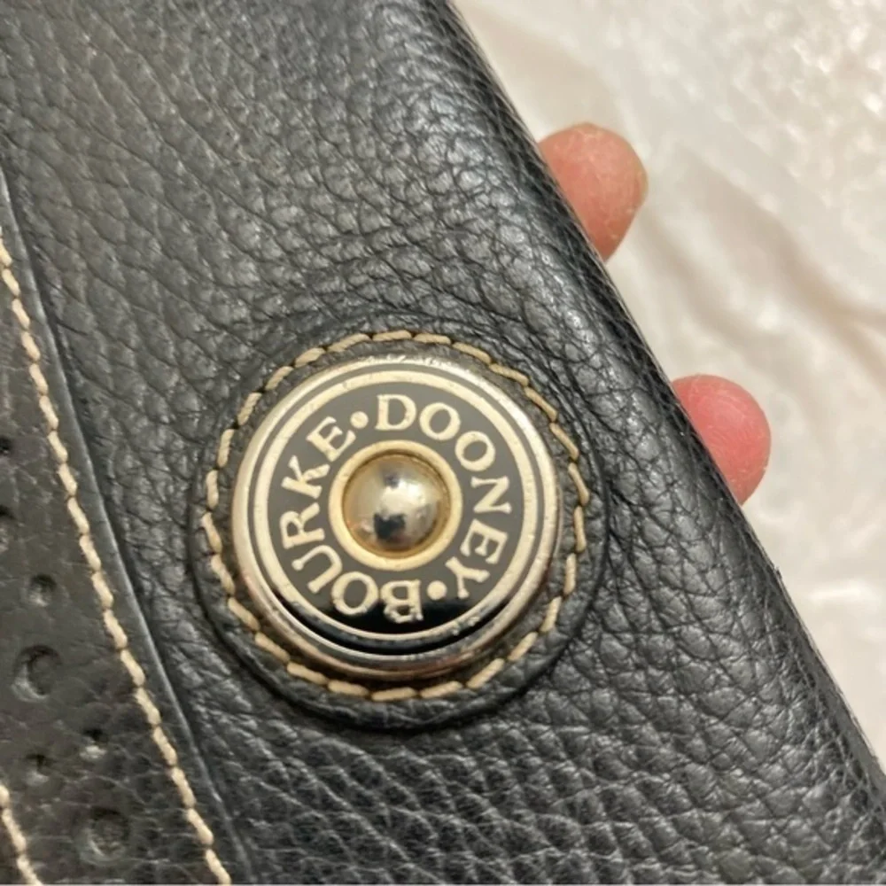 Dooney and Bourke rare perforated black pebbled leather 2 piece wallet set